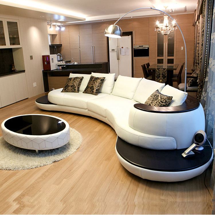 Стильный полукруглый островной диван в интерьере комнаты